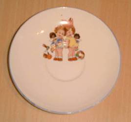 Childs saucer with Golly's